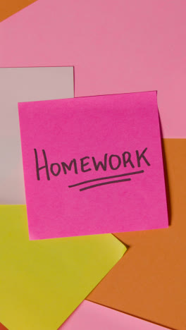 Vertical-Video-Education-Concept-Of-Revolving-Sticky-Notes-With-Homework-Written-On-Top-Note